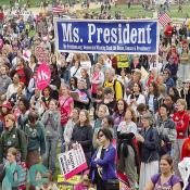 Marchers from Ms. President, a national polical action committee, proudly hold their banner 
 Ms. President 
Ms-President.org: Democrats Winning Back the White House, Senate & Presidency!