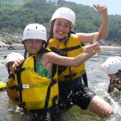 Refreshing Potomac River cools off rafters as they get ready to learn proper rapid swimming position.