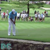 Adam Scott putts on the sixth green.