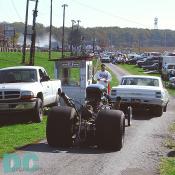 The time slip pickup booth is the next stop for drag racers finishing a run. Another look at that unsponsored dragster pulling up behind a 1965 Chevelle Malabu. I guess He didn't need the 'chute!