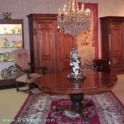 A view of our showroom including fine furniture and majolica collections - note especially the unusual pair of Renaissance Revival blind door armoires and the floral Aubusson tapestry.