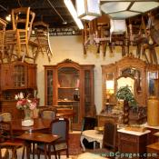Chelsea and Co. Antiques - Armores, bookcases, chairs hanging everywhere. The blue chairs are a set of 8 Louis Philippe dining chairs.