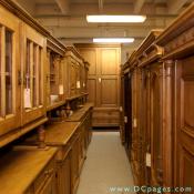 Great British Pine Mine - In the Pine Mine's antiques room, a corridor of exquisite armoires and kitchen cupboards.