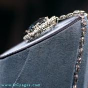 In 1911, the Hope diamond was sold to Mrs. Evalyn Walsh McLean of Washington, D.C., after it was mounted on a headpiece and surrounded by three tiers of white diamonds. Sometime later, Mrs. McLean had it reset as a pendant.