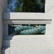 The pillars are connected by bronze sculpted rope that symbolize the bonding of our Nation.