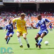 A battle between Metro Stars Pope and Dallas Burn O'Brien.