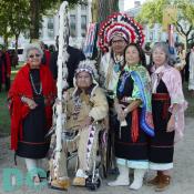 Anne Lewis Hansen, Wanda Lim Amy, and Diana Lim Garry, are in this picture. They are dressed in the traditional regalia of the Pueblo of Acoma people from New Mexico. Anne Lewis Hansen is the daughter of the late Lucy M. Lewis who is a famous potter from the Pueblo of Acoma. Lucy's pot is currently on the new U.S. Postal Service stamps commemorating the opening of the new museum. 
