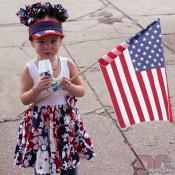 Little Mrs. America enjoying her popsicle.