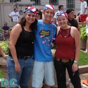 Three patriotic teens watching the parade.