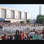 The Navy processional marches past the Museum of American History.