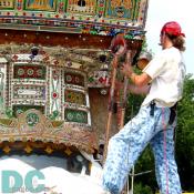 The Folklore Bus is recieving a new coat of paint.  This gypsy-like mobile has scenes from the capital including the various monuments such as the Capital building and the Washington Monument.