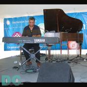 The Haitian pianist playing on the keyboard.