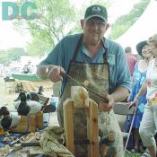 A decoy master shapes the wood pieces into decoys.