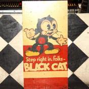 A  Black Cat sign welcomes DC concert goers to come in and enjoy the show.