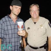 A Montgomery County police officer and a party patron discuss the law of the jungle. 