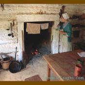 Hanging the kitchen cloths to dry near the hearth fire.