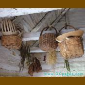 These baskets hold herbs and vegetables. During colonial times food baskets were hung to keep the mice and bugs away.