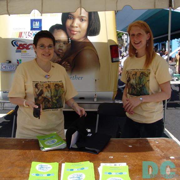 Adams Morgan day staff welcome visitors to the festival.