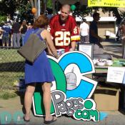 DCpages Sales Director, Ed Palmedo, shares community information with this woman.
