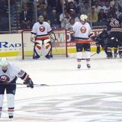 Jagr helps Mike Grier to his feet before celebrating Griers second period goal.