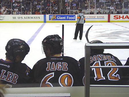 Kip Miller and Jagr discuss strategies while taking a quick breather.