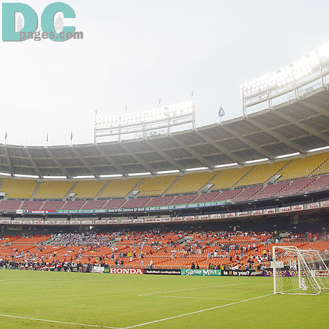 The RFK Stadium stand was getting crowded with tons of soccer fans to watch a home game of DC United. 