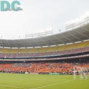 The RFK Stadium stand was getting crowded with tons of soccer fans to watch a home game of DC United. 