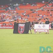 Volunteer kids were showing the team flag of DC United and a commercial flag of US Youth Soccer & KOHL'S. 