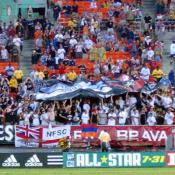 The Screaming Eagles put their hands up and waved their team's flag after DC United's goal.