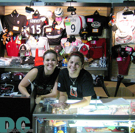 Michelle and Candice are all smiles while selling DC United accessories.