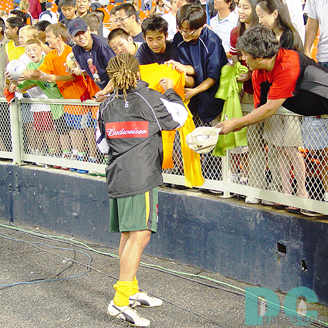 "Look at my ball! I got Cobi's autograph" Galaxy No.13 Cobi Jones was also requested to sign for his fans. 