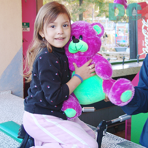 I asked this young girl, "Have you seen anything scary today at the park?" No, but I won this cuddly Teddy Bear."