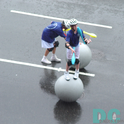 One of the many groups that partook in the parade.  This boy juggles as he rolls on a ball, an interesting skill.