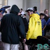 A Washingtonian cyclist takes a moment to talk to a bystander, answering questions about his cycling club.