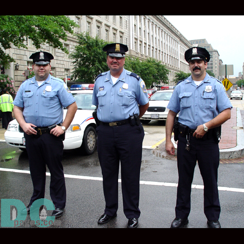 Security around the National Mall was, as usual, very tight.  Large celebrations and festivals could be a potential weakspot in national security.  These three cops take a few moments out of their time to take a picture.