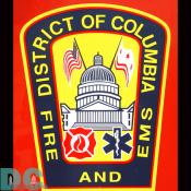 A DC Fire and EMS Emblem found on the side of a fire truck parked on the Mall.
