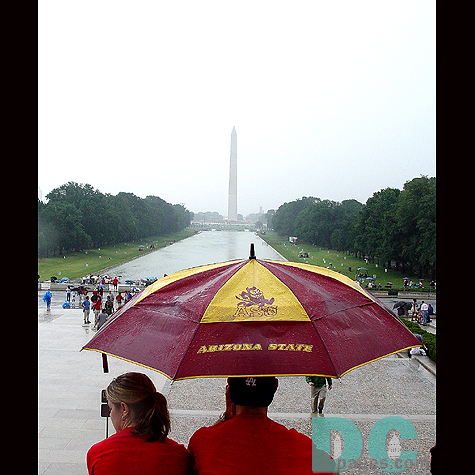 An Arizona State Alumni takes a moment to look down at the Reflecting Pool and the Washington Monument on this Fourth of July.