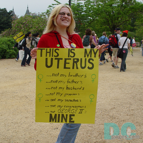 Pro-Choice activist holds demonstration sign - THIS IS MY UTERUS, ...not my brother's, ...not my father's, not my husband's, ...not my governor's, ...not my senator's, ...not my congressman's, ...not GEORGE II's, MINE -