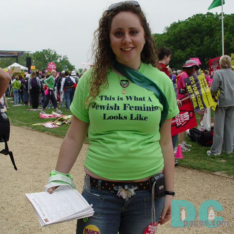 A young activist proudly displays her demonstration shirt - This is What A Jewish Feminist Looks Like -