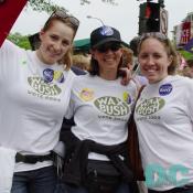 Three marchers show their support for John Kerry by wearing shirts that read WAX BUSH, VOTE 2004.