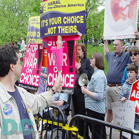 Planned Parenthood marchers direct their signs, STOP THE WAR ON CHOICE!, to the Pro-Life advocates that lined the march route.