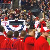 One last wave to the crowd from President Bush as he and manager Manny Acta walk of the field at Nationals Park.