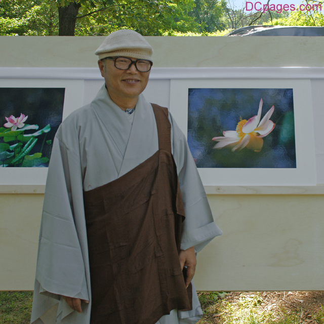 Venerable SungHyo Sunim Stands Next to His Favorite Photograph
