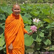 Venerable: Onla Inthichak Holds Sacred Lotus Blossom