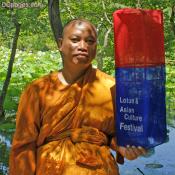 Buddist monk holds festival lantern