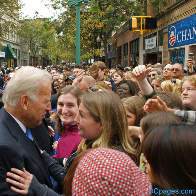 Senator Biden embraces the crowd.