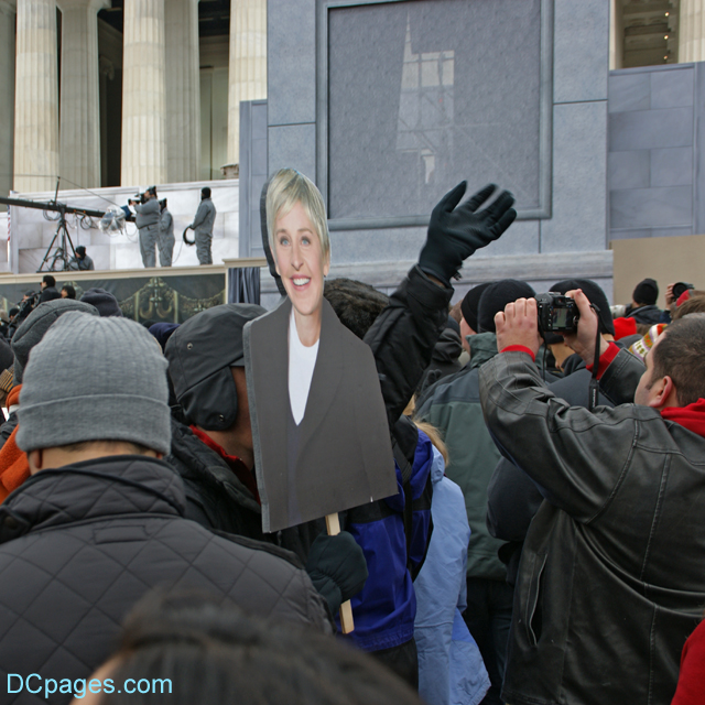 Man holds up Ellen DeGeneres Sign