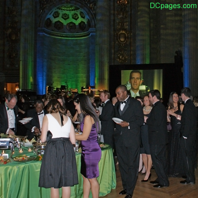 Partygoers sample the organic food.