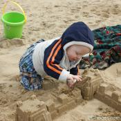 Baby Luke making his first sand castle