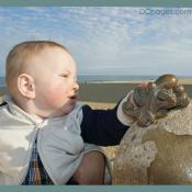 Baby Luke touches bronze octopus
